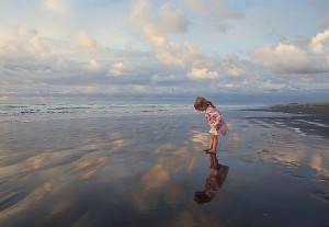 girl on beach exploring